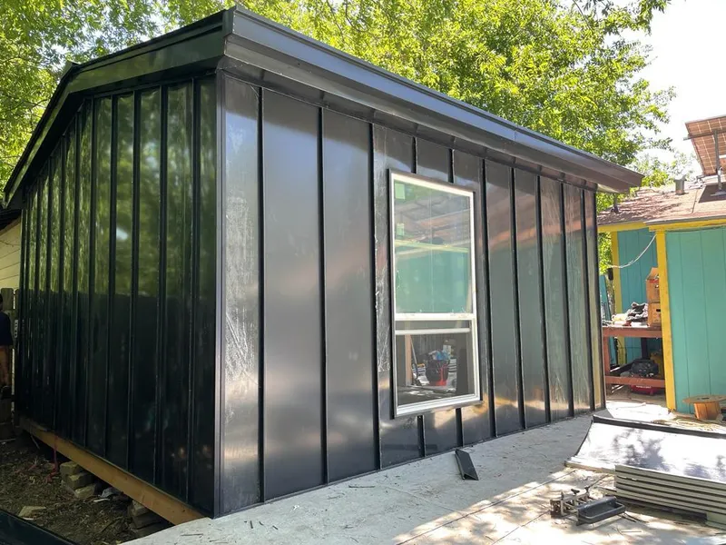 Black standing seam metal wall panels for Metal Roof Installation in Alma