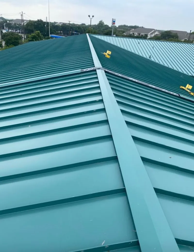 Green commercial metal roof ridge and valley for Metal Roof Repair in Alma